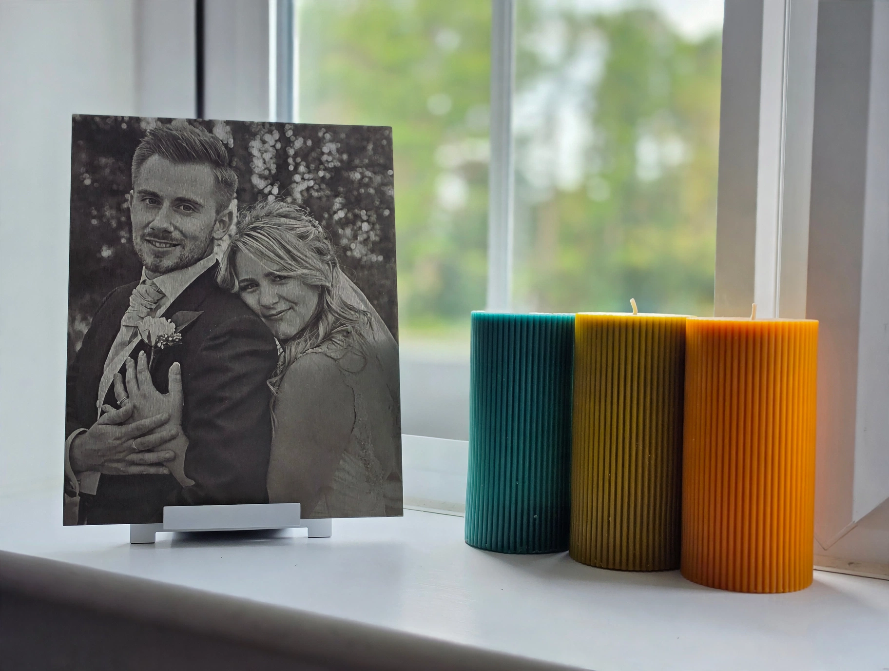 A Joyly steel keepsake on a display stand